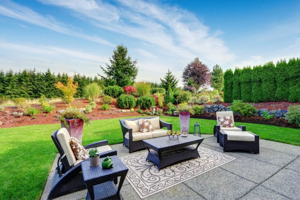 A beautiful backyard with furniture and landscaping, perfect for backyard patio ideas.