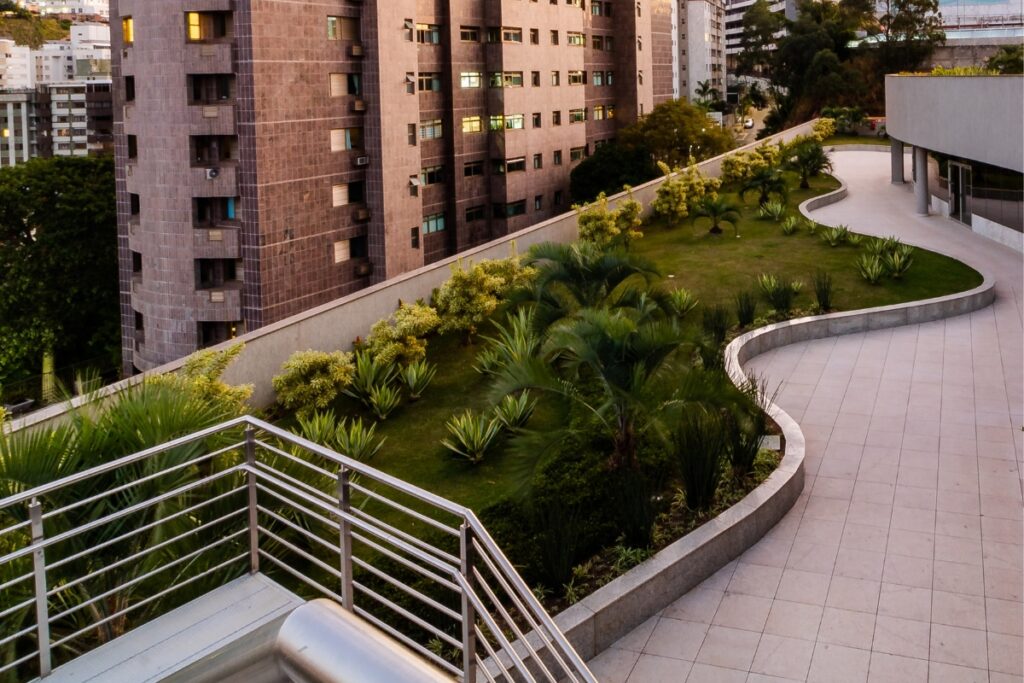 A scenic balcony showcasing the latest landscape architecture trends in a city with tall buildings.