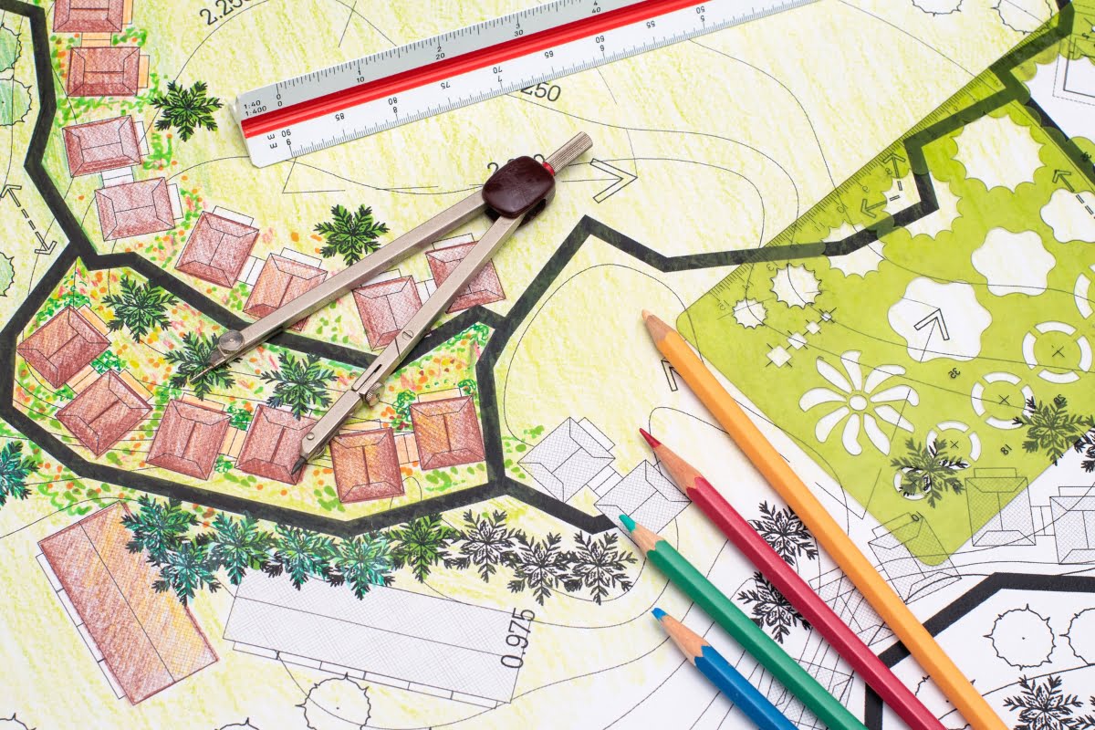 A drawing of a landscape plan using colored pencils and a ruler, showcasing current Landscape Architecture Trends.