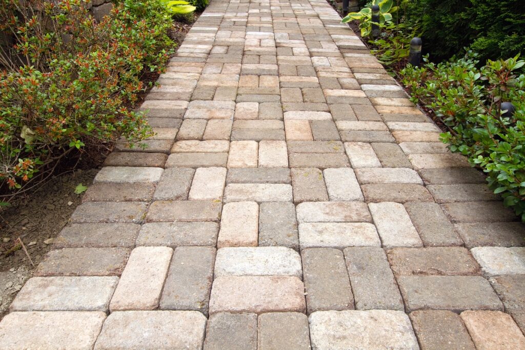 Building a Garden Path: A walkway with brick pavers in a garden.