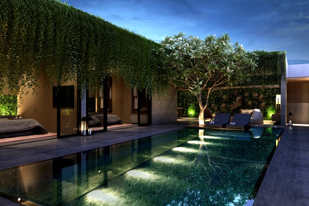 Commercial Water Features in Smyrna: How They Help Attract More Customers 6 Modern outdoor pool area at dusk with lounge chairs, beds, a tree, and walls covered in green vines beside a contemporary building, enhanced by elegant commercial water features.