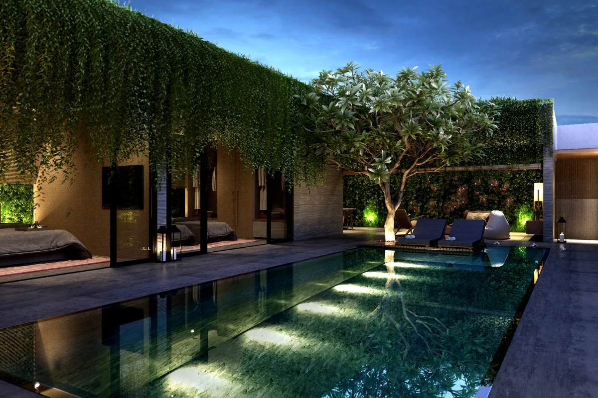 Commercial Water Features in Smyrna: How They Help Attract More Customers 6 Modern outdoor pool area at dusk with lounge chairs, beds, a tree, and walls covered in green vines beside a contemporary building, enhanced by elegant commercial water features.